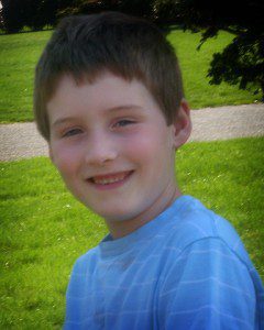 young boy smiling-portraits of autism