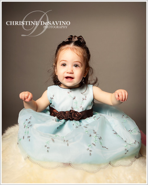 Child Portrait of a beautiful girl in an elegant blue dress