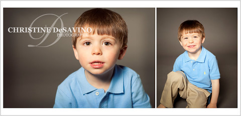 Adorable brown-eyed boy in blue polo shirt posing for a studio portrait