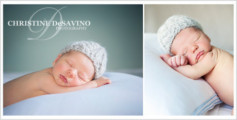 Adorable newborn boy in knit hat resting on a pillow.