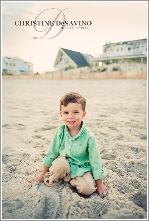 Handsome boy in the sand on the beach at Long Beach Island