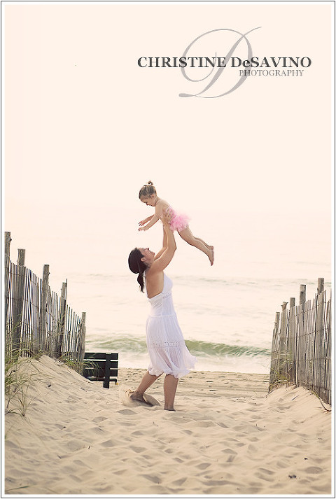 Mother holding daughter in the air on LBI - NJ Beach Photographer