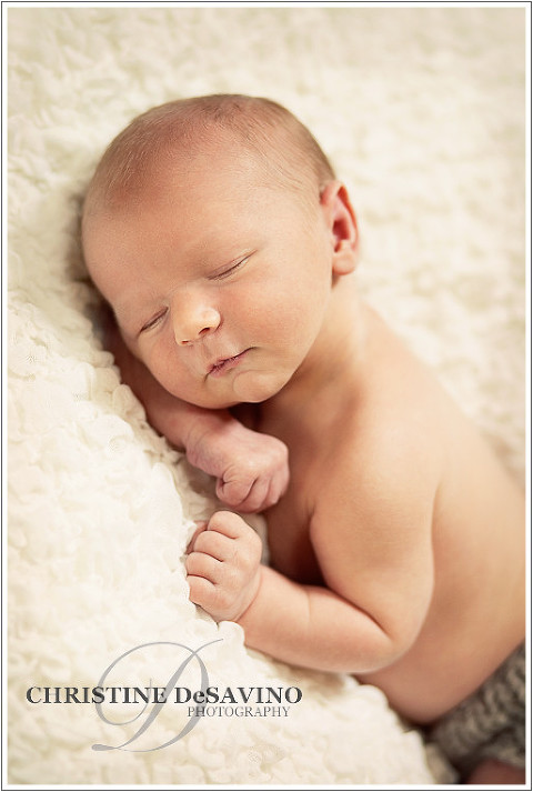 Newborn baby boy sleeping on white blanket - NJ newborn photographer