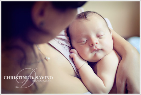 Baby boy in mother's arms - NY Newborn Photographer