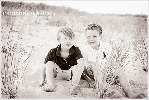 Black and white image of two brothers on the dunes - NJ Beach Photographer