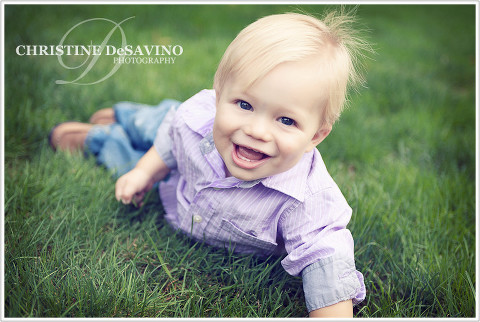 One year old boy laughing on the grass - NJ Children's Photographer