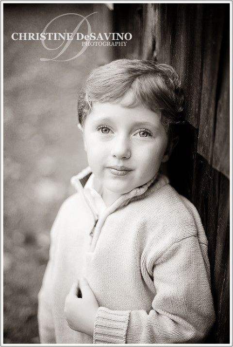 Black and white of boy gazing at the sky - NY Child Photographer