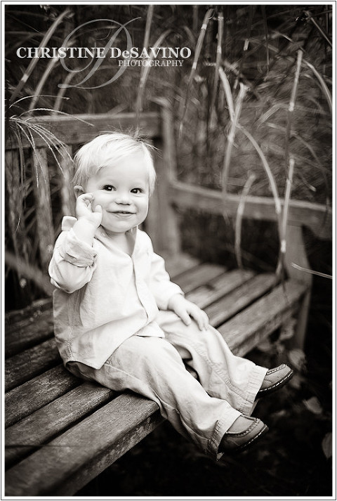 Black and white of adorable boy on bench - NJ Children's Photographer