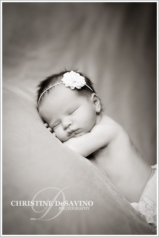 Black and white newborn with flower - NJ Newborn Photograper