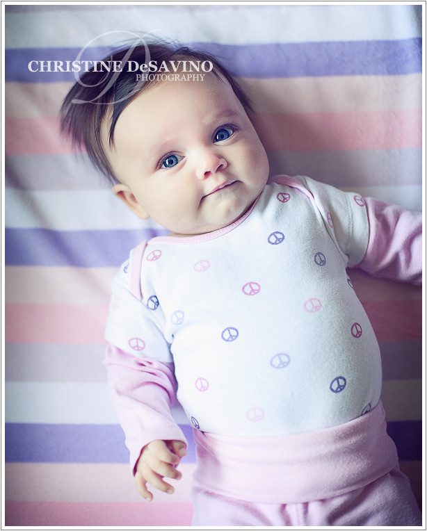 Baby wearing peace signs on stripes - NY Baby Photographer
