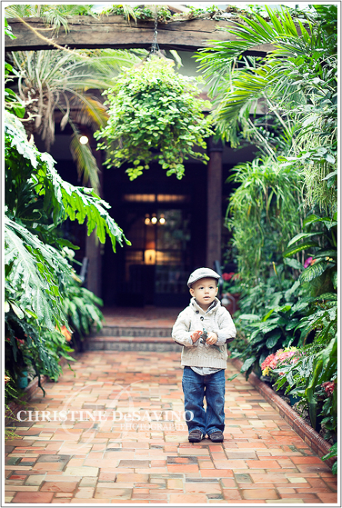 Boy standing in greenhouse - NJ Child Photographer