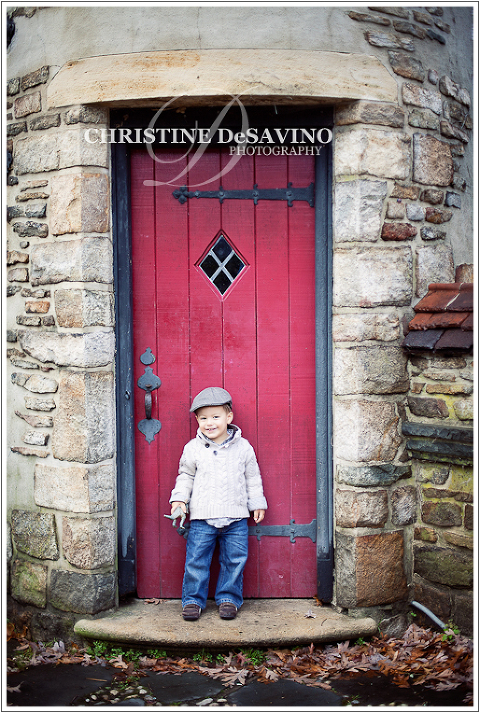 Boy by a red door - NJ Child Photographer