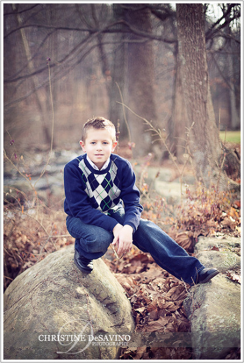 Boy kneels by rocks - NJ Children's Photographer