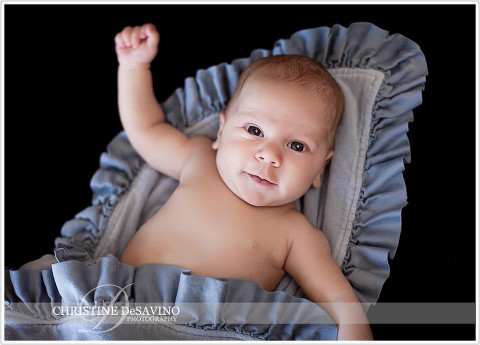 Smiling baby on blue blanket - NY Baby Photographer