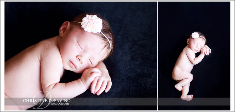 Newborn girl on black with flower headband - NJ Newborn Photographer