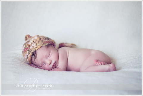 Newborn girl on white with knit hat - NJ Baby Photographer