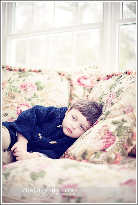 Beautiful boy enthralled on the couch - NJ Child Photographer