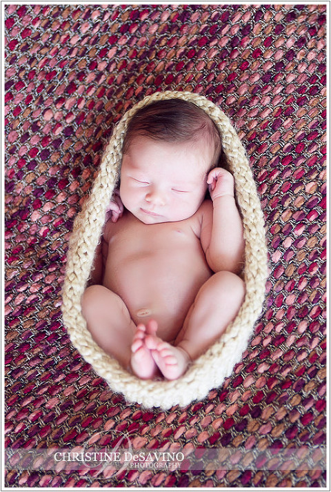 Newborn girl in cocoon on a pink blanket - NJ Newborn Photographer