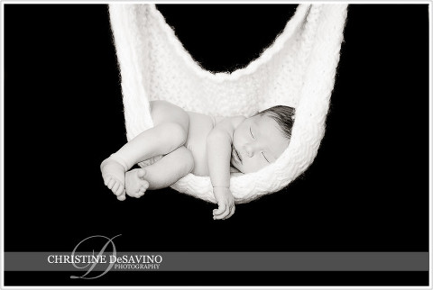 Black and white of newborn girl in a hammock - NJ Newborn Photographer