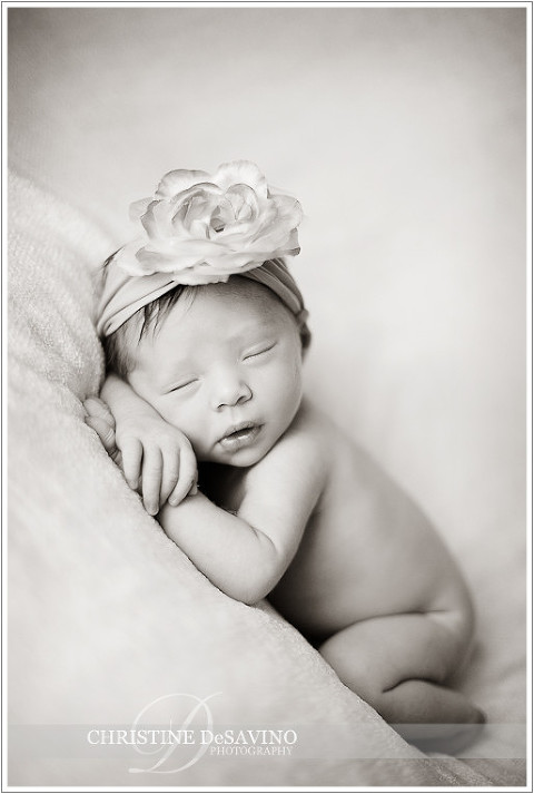 Black and white of newborn girl with flower headband - NJ Newborn Photographer