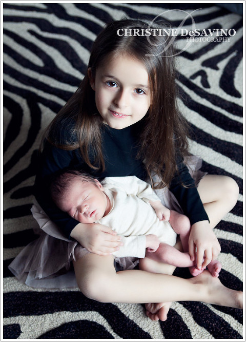 Beautiful girl holds baby brother - NJ Child Photographer