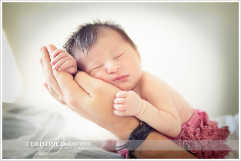 Newborn in father's hand - NJ Newborn Photographer