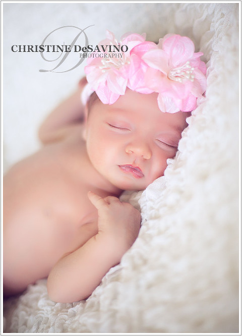 Delicate newborn girl wearing flower headband - NJ Newborn Photographer