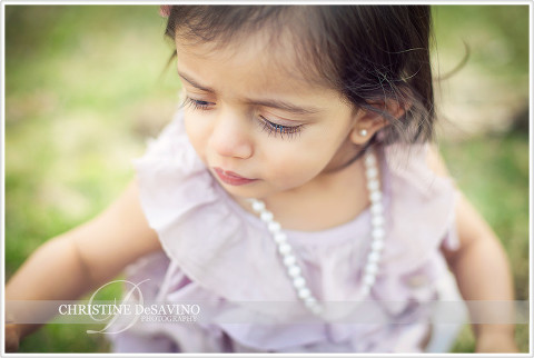 Close up of little girl wearing pearls - NY Child Photographer