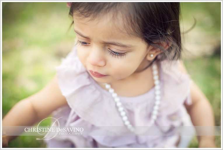 Close up of little girl wearing pearls - NY Child Photographer