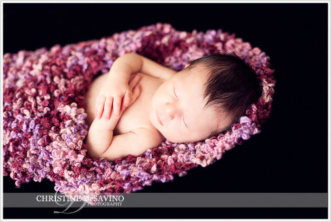 Newborn girl in pink knit wrap - NJ Baby Photographer