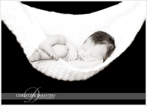 Newborn sleeping in hammock - NJ Baby Photographer