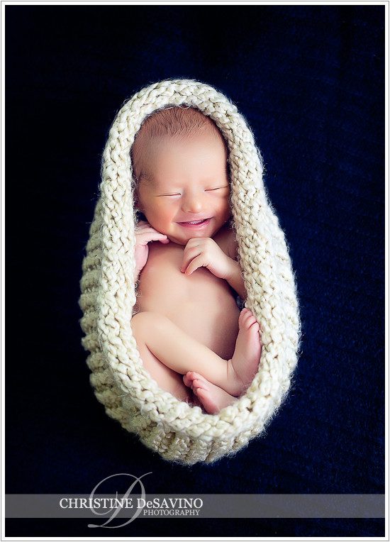 Newborn smiling in cocoon - NJ Newborn Photographer