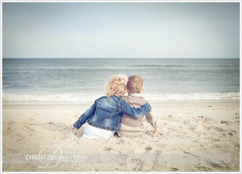 Sister and brother look out at ocean - NJ Beach Photographer
