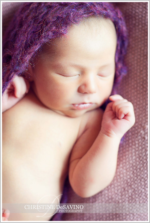 Precious newborn girl in purple wrap - NJ Newborn Photographer