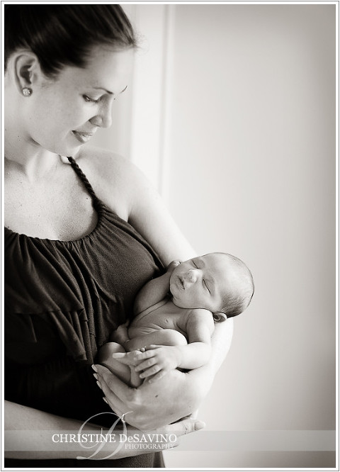 Beautiful mom holds baby girl - NJ Newborn Photographer