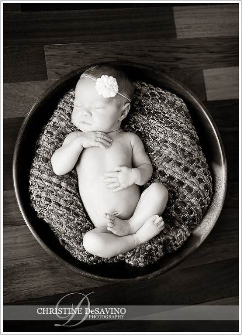 Black and white image of newborn in wooden bowl - NJ Newborn Photographer