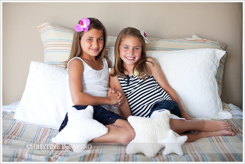 Sisters on bed with star pillows - NJ Beach Photographer