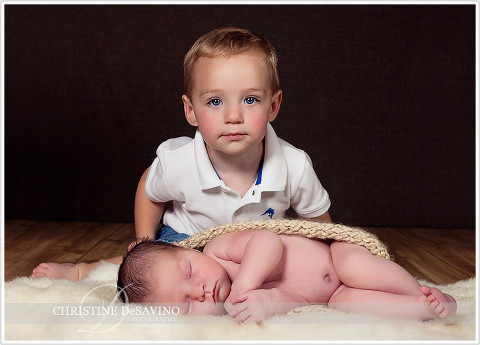 Sleeping newborn girl with big brother - NJ Newborn Photographer