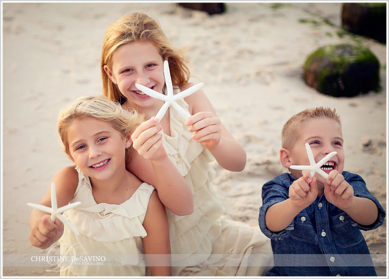 Siblings with starfish - NJ Beach Photographer