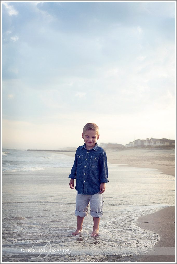 Boy wades in ocean  - NJ Beach Photographer
