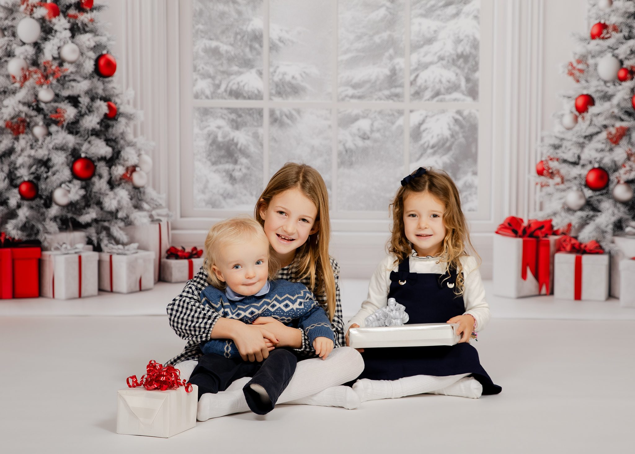 Holiday Minis 2025 three siblings holiday portrait with snowy backdrop — Bergen County NJ children’s photography